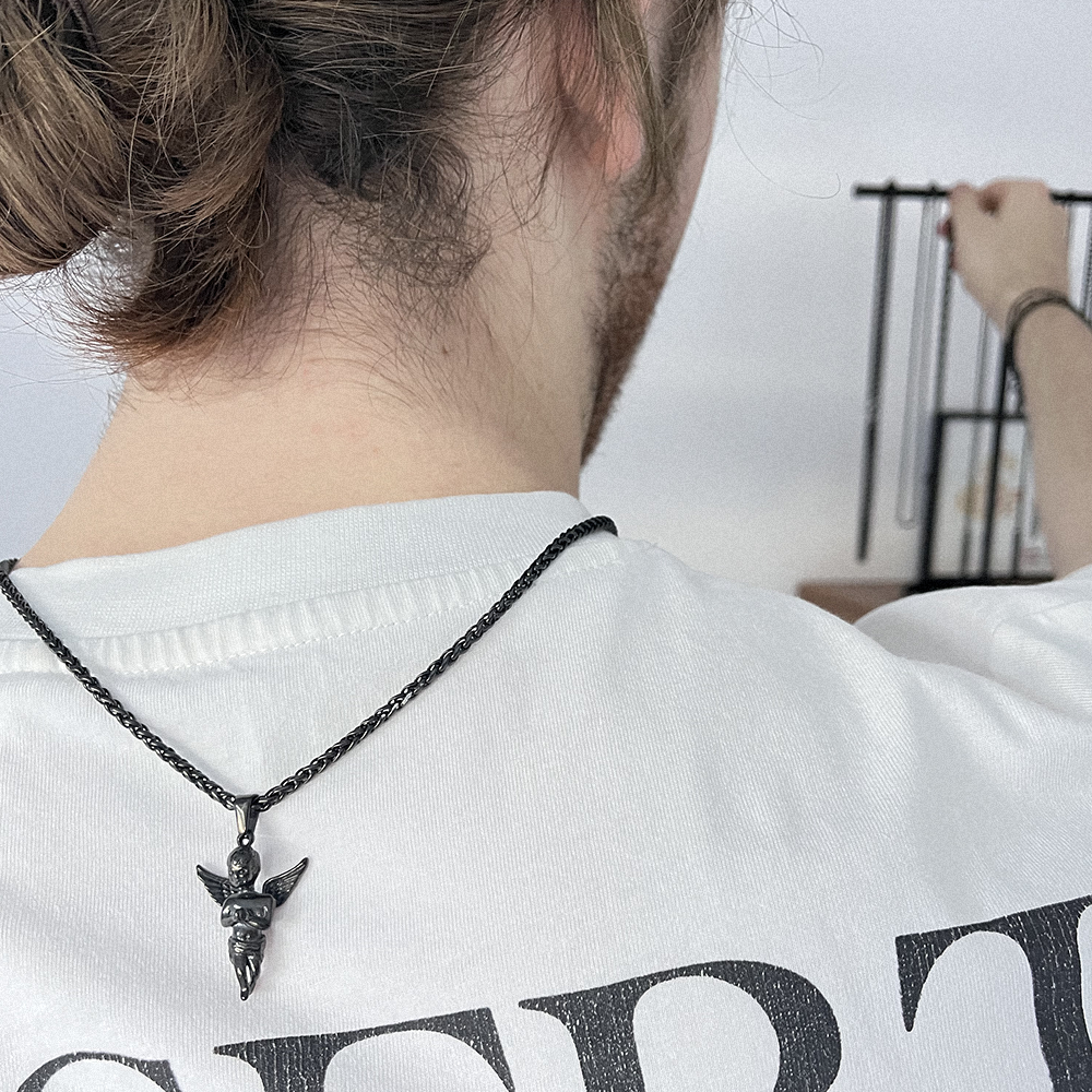 black angel pendant, modelled behind