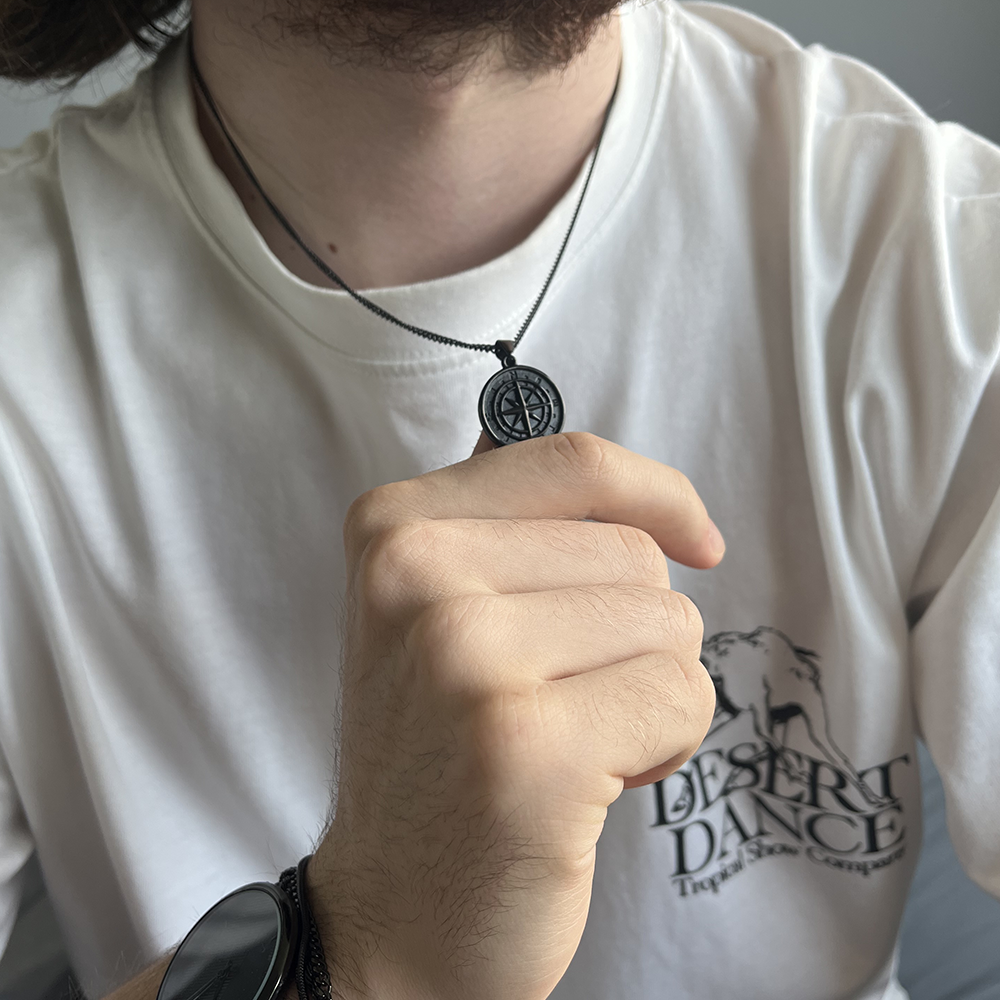 Black Compass Pendant, modeled in hand